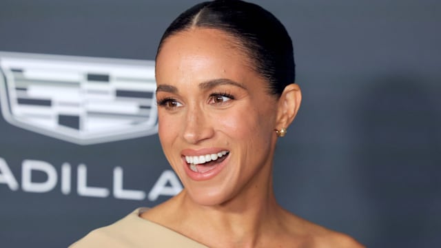 meghan markle in drape dress at power of women event 