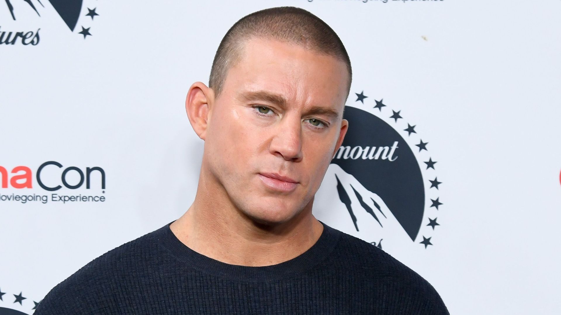 photo of channing tatum in blue sweater at cinemacon