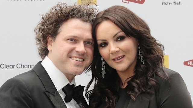 Jack McManus in a black tuxedo and Martine McCutcheon in a blakc dress