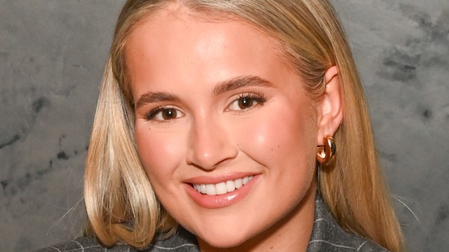 Molly-Mae Hague wearing a grey blazer, attends the VIP launch of FENIX Manchester, in partnership with PATRÃN El Cielo, on November 23, 2023 in Manchester, England. 