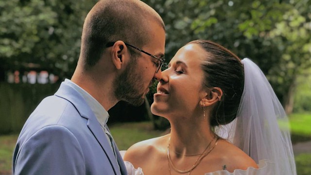 Real life bride and groom in a park