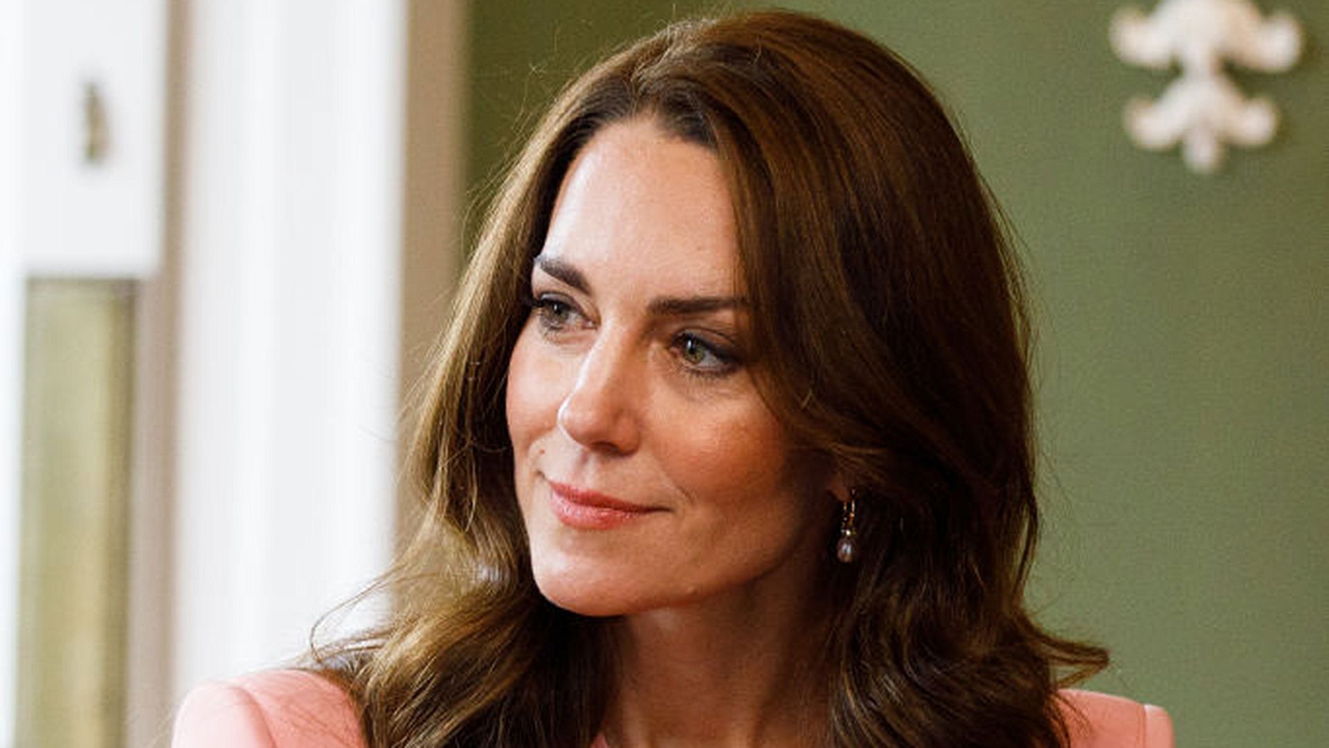 Princess Kate listening to others during a visit to a Foundling Museum in London