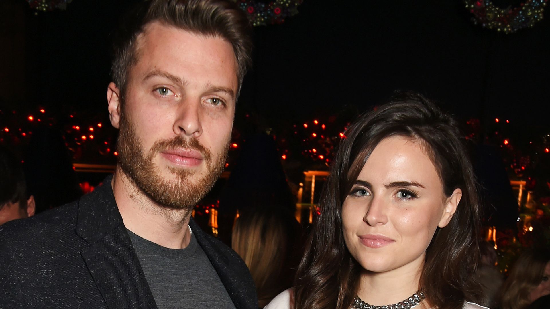 Rick Edwards in a black cardigan and Emer Kenny in a white blouse at the Sunday Times Style Christmas Party in 2015