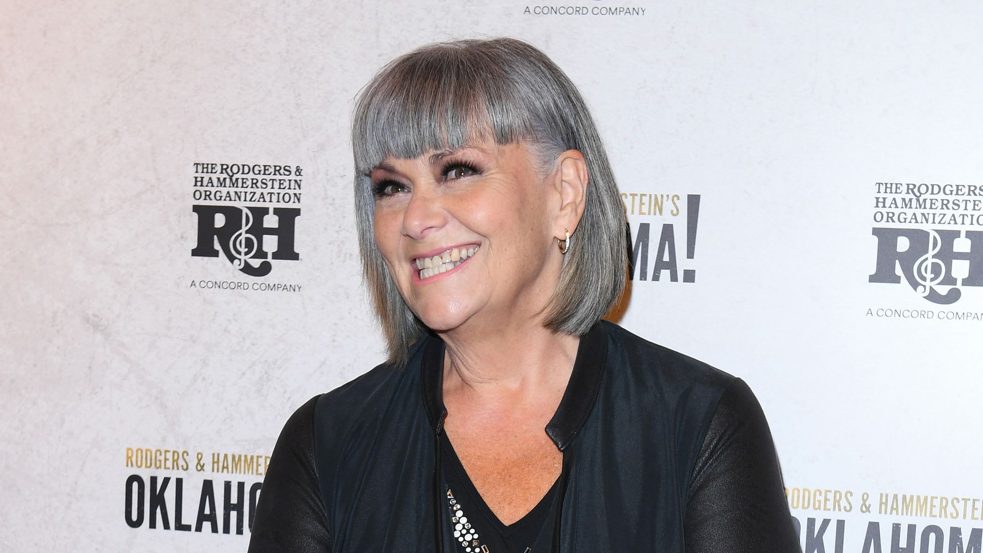 Dawn French on a red carpet in black
