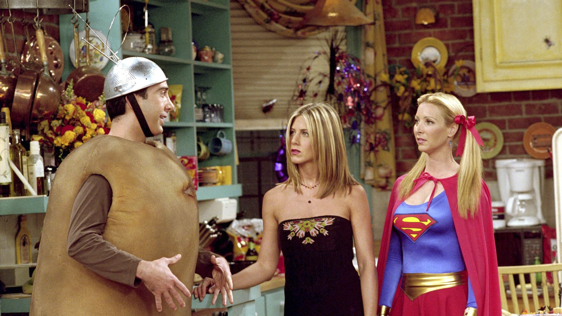 FRIENDS -- "The One with the Halloween Party" -- Epsiode 6 -- Aired 11/1/2001 -- Pictured: (l-r) David Schwimmer as Dr. Ross Geller as "Spudnik", Jennifer Aniston as Rachel Green as "Rachel", Lisa Kudrow as Phoebe Buffay as "Supergirl" -- Photo by: NBCU Photo Bank