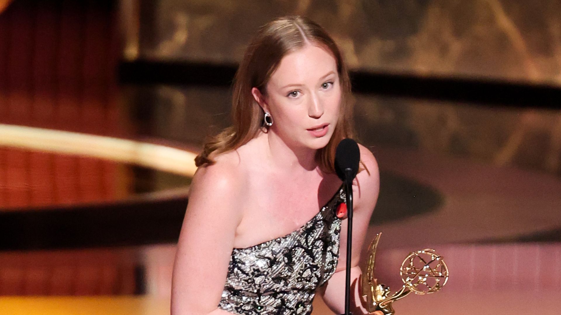Hannah Einbinder accepts the Emmy Award for Outstanding Supporting Actress in a Comedy Series in "Hacks" at the 77th Primetime Emmy Awards held at the Peacock Theater on September 14, 2025 in Los Angeles, California