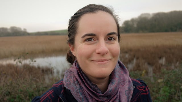 Headshot of a woman smiling in nature