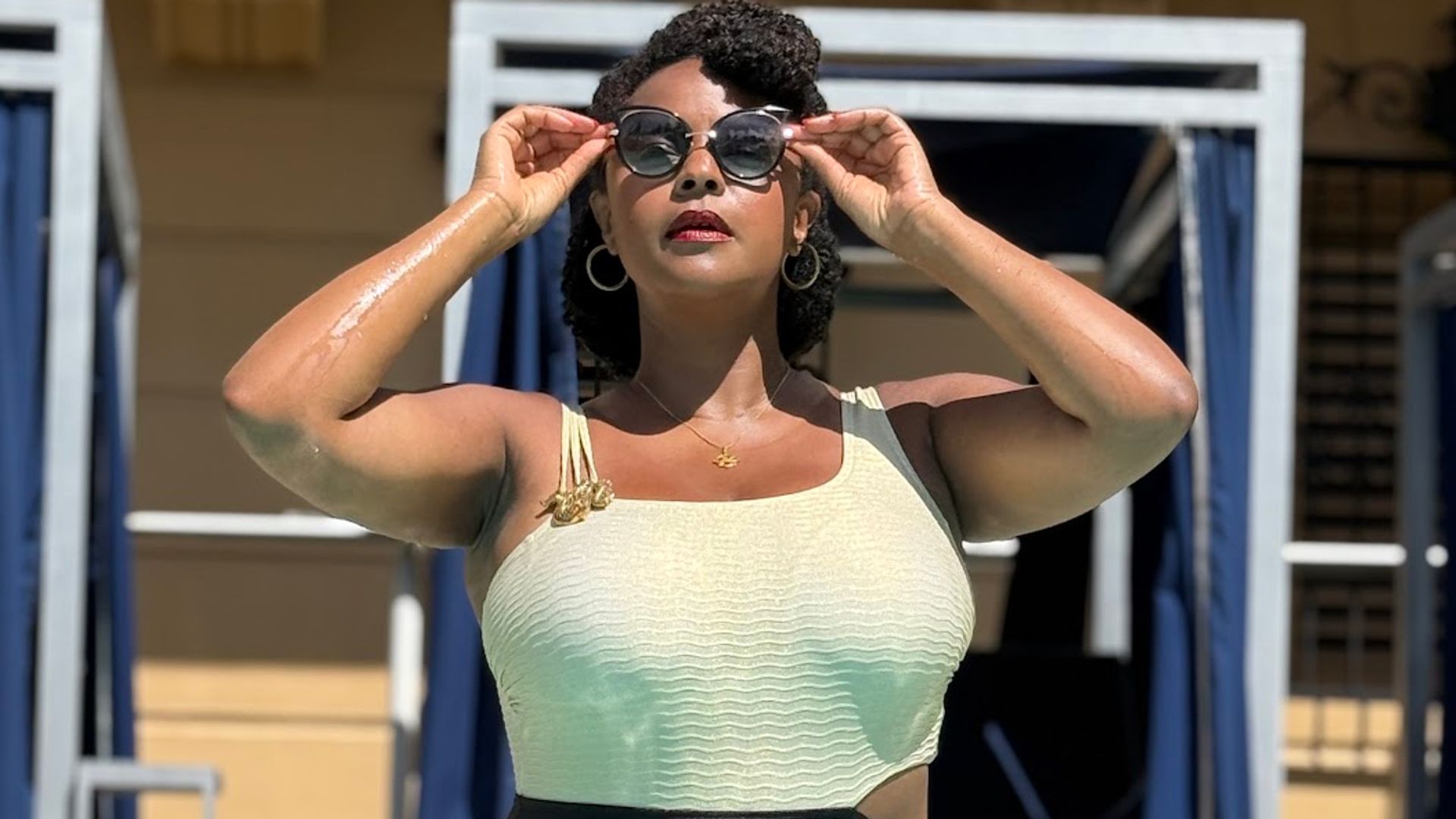 Jenny Rieu wearing a black and white swimsuit