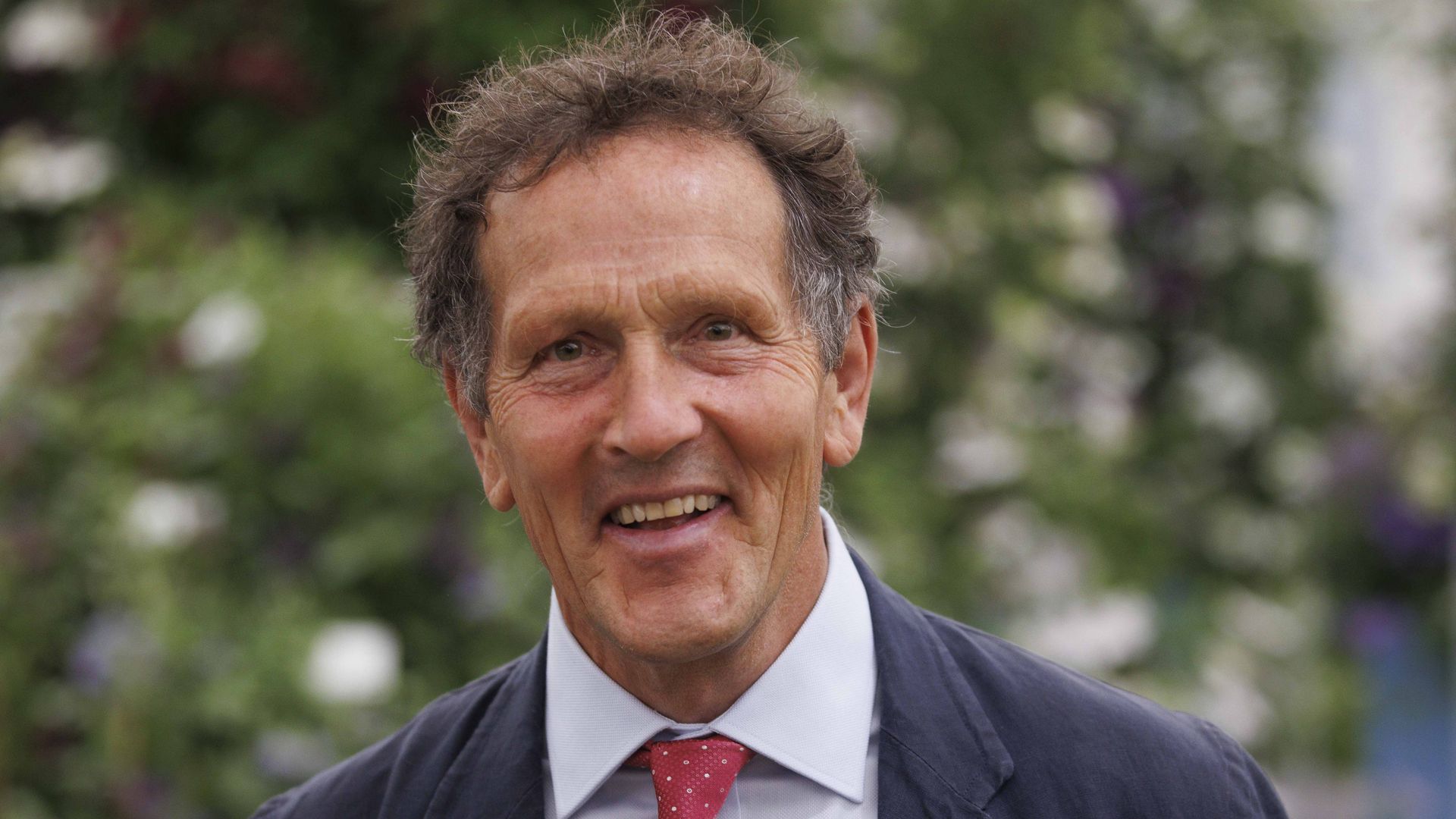 Monty Don smiles as he attends Chelsea Flower Show