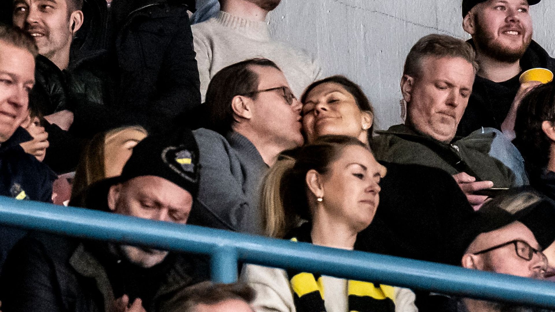 Prince Daniel kissing Crown Princess Victoria on the cheek