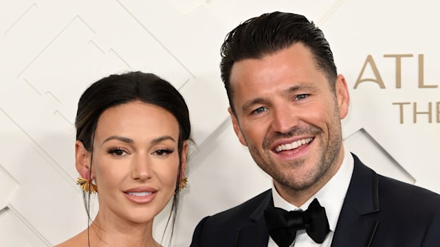 couple posing on red carpet