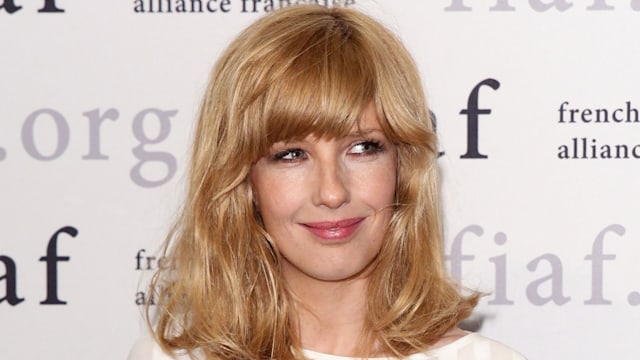 Kelly Reilly wearing a white dress