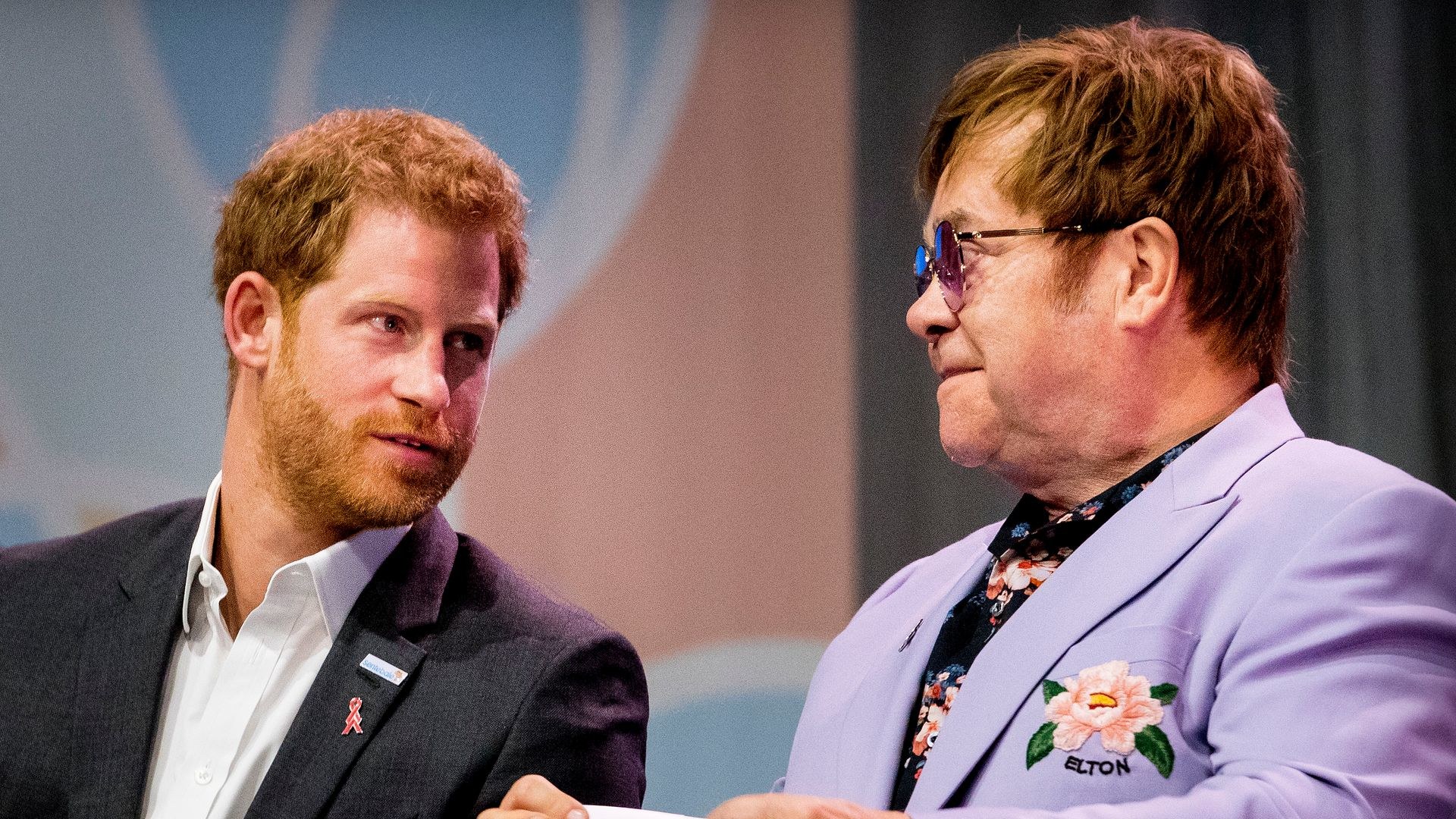 Sir Elton John and Prince Harry attend the 2018 International AIDS Conference 