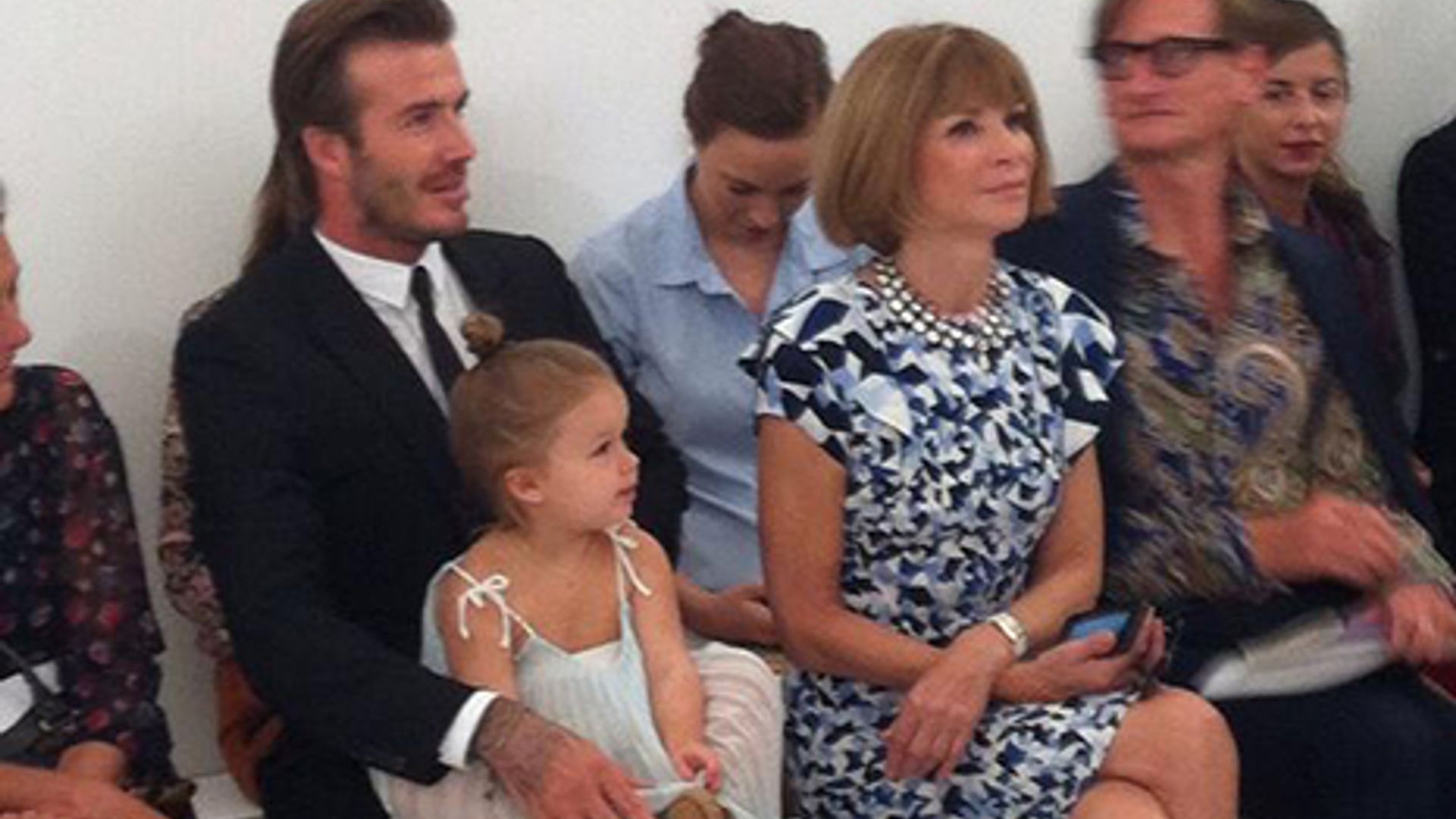 Adorable Harper Beckham sits front row at mother Victoria Beckham's fashion show
