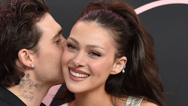 Nicola Peltz and Brooklyn Beckham share a moment at the premiere of Lola in LA