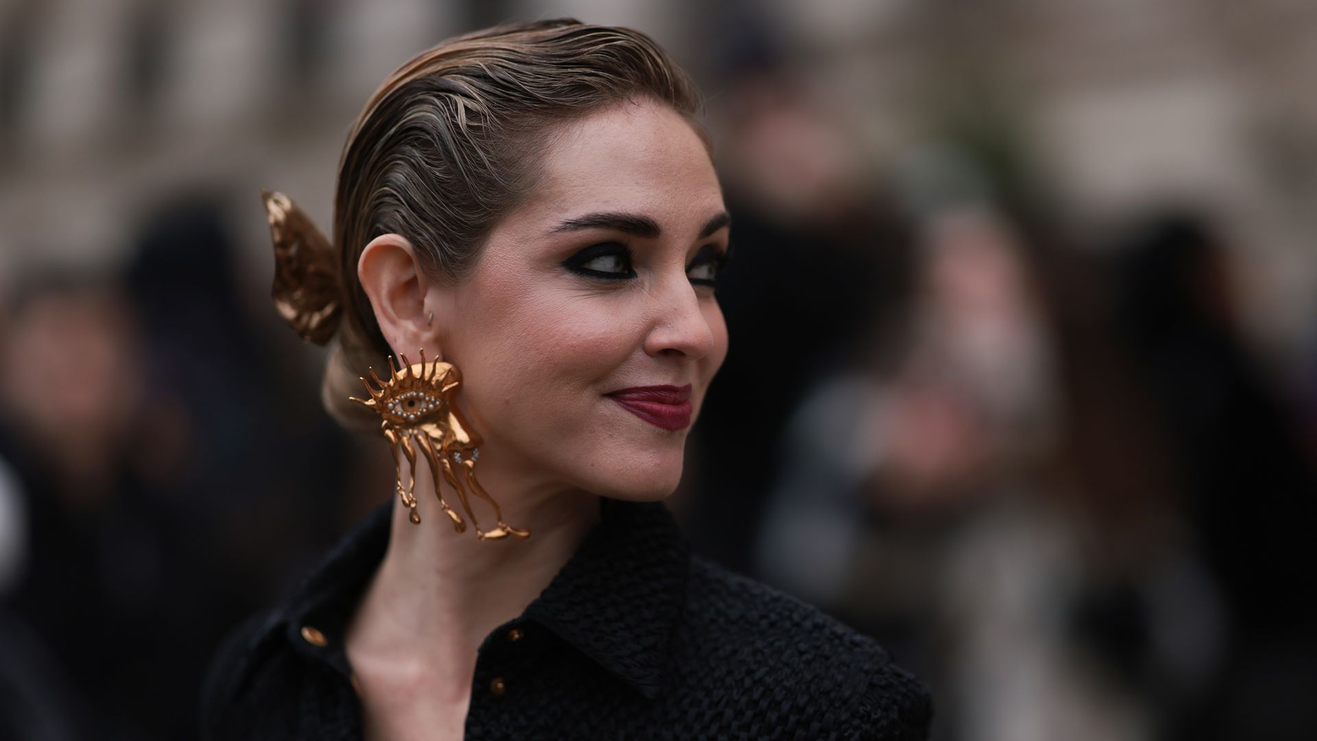 PARIS, FRANCE - JANUARY 23: Chiara Ferragni seen wearing a black blazer and golden Schiaparelli statement earrings and Schiaparelli hairdetails, outside Schiaparelli show, the Paris Fashion Week - Haute Couture Sring Summer 2023 on January 23, 2023 in Paris, France. (Photo by Jeremy Moeller/Getty Images)