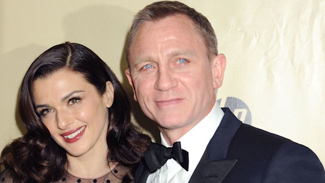 rachel weisz posing with daniel craig on the red carpet 