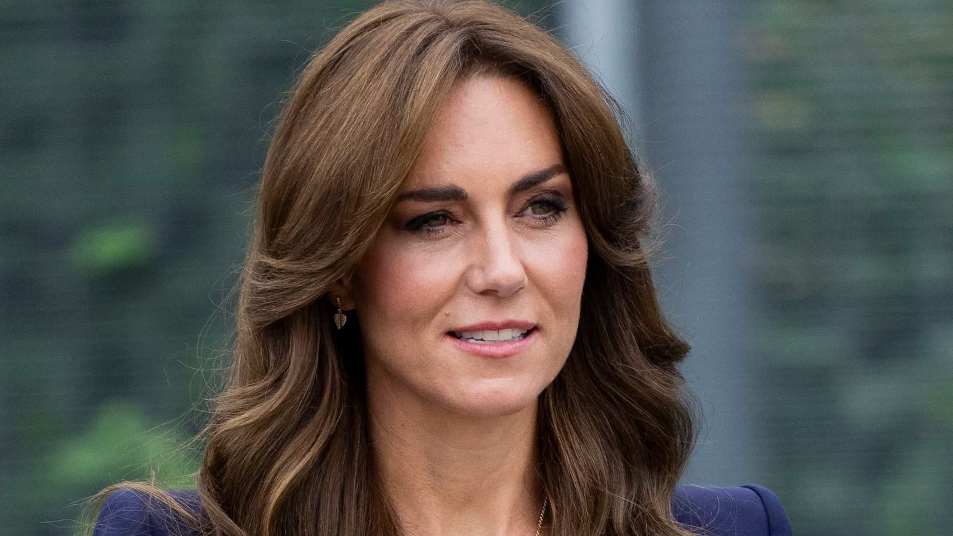 Kate wearing dark blue suit