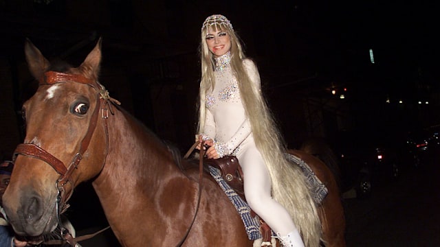 Model Heidi Klum arrives on horseback as Lady Godiva at her Annual Halloween Party at Lot 61 in New York City