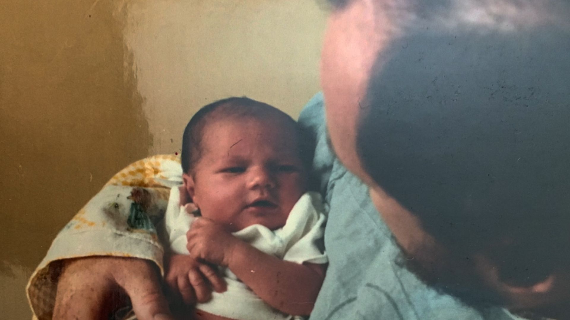 Thomas Markle holding a baby Meghan Markle