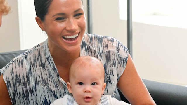 Meghan laughing with Archie