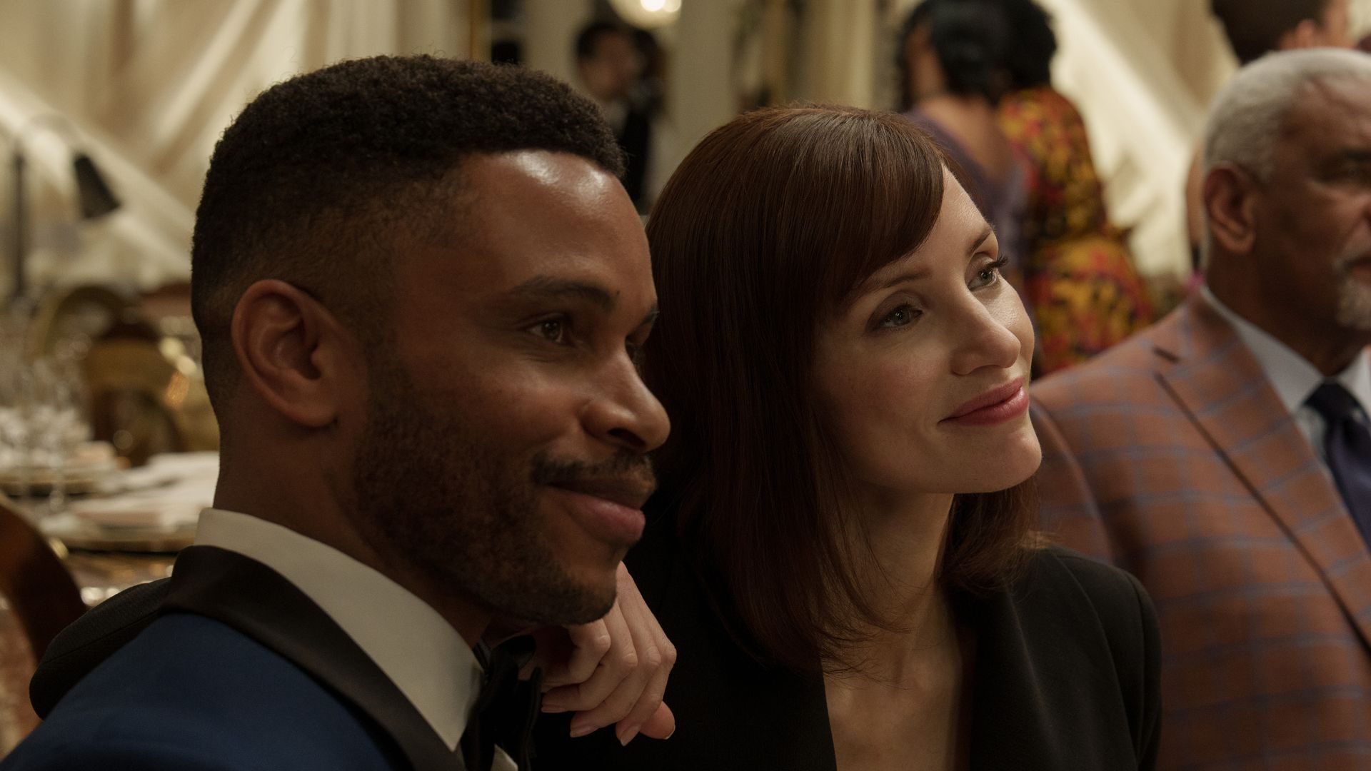 man and woman sitting at dinner table