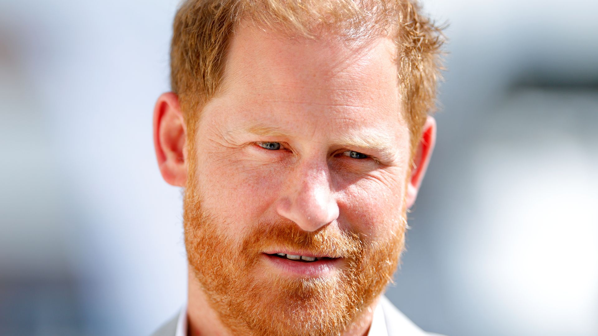 Prince Harry in grey suit, close-up