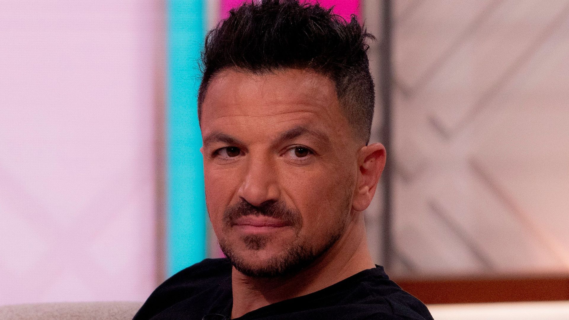 Peter Andre sitting down
