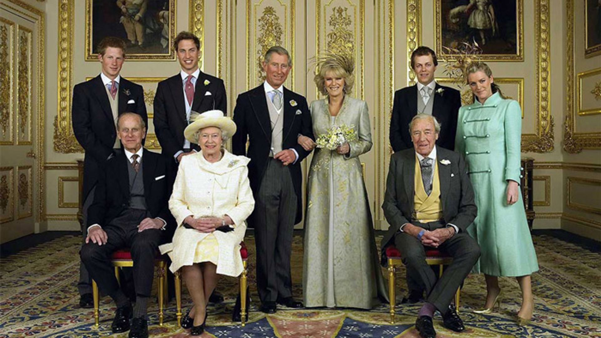 Charles and Camilla posing for wedding photos alongside their close family