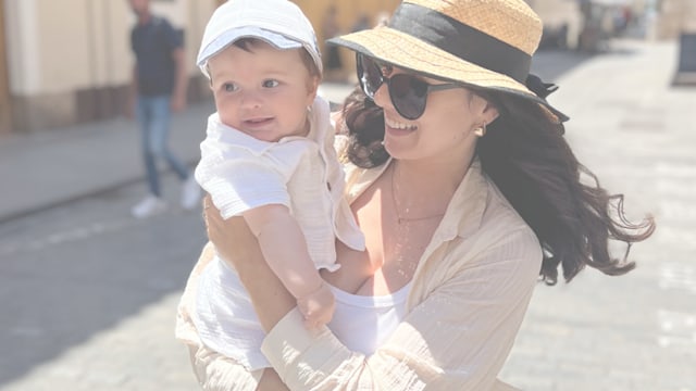 woman with baby in sun hats