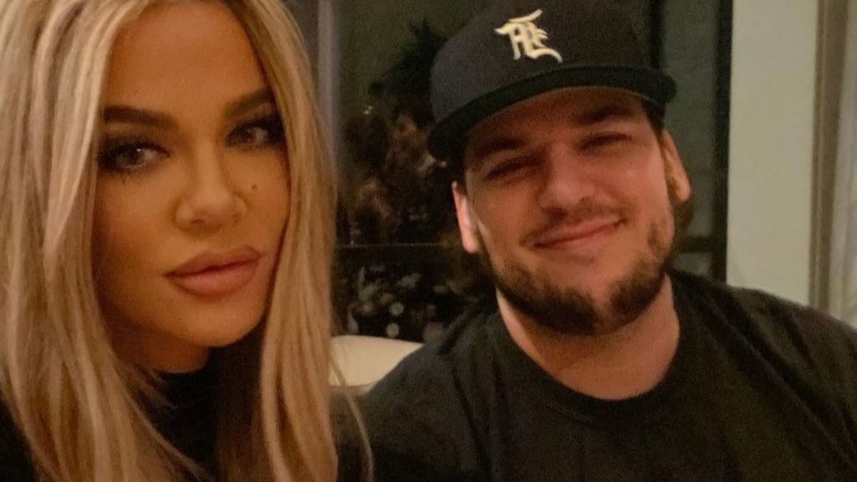 Rob Kardashian beams as he makes an exception to be filmed with his famous family and Malika Haqq