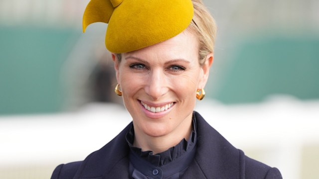 Zara Tindall wearing a yellow hat at Cheltenham