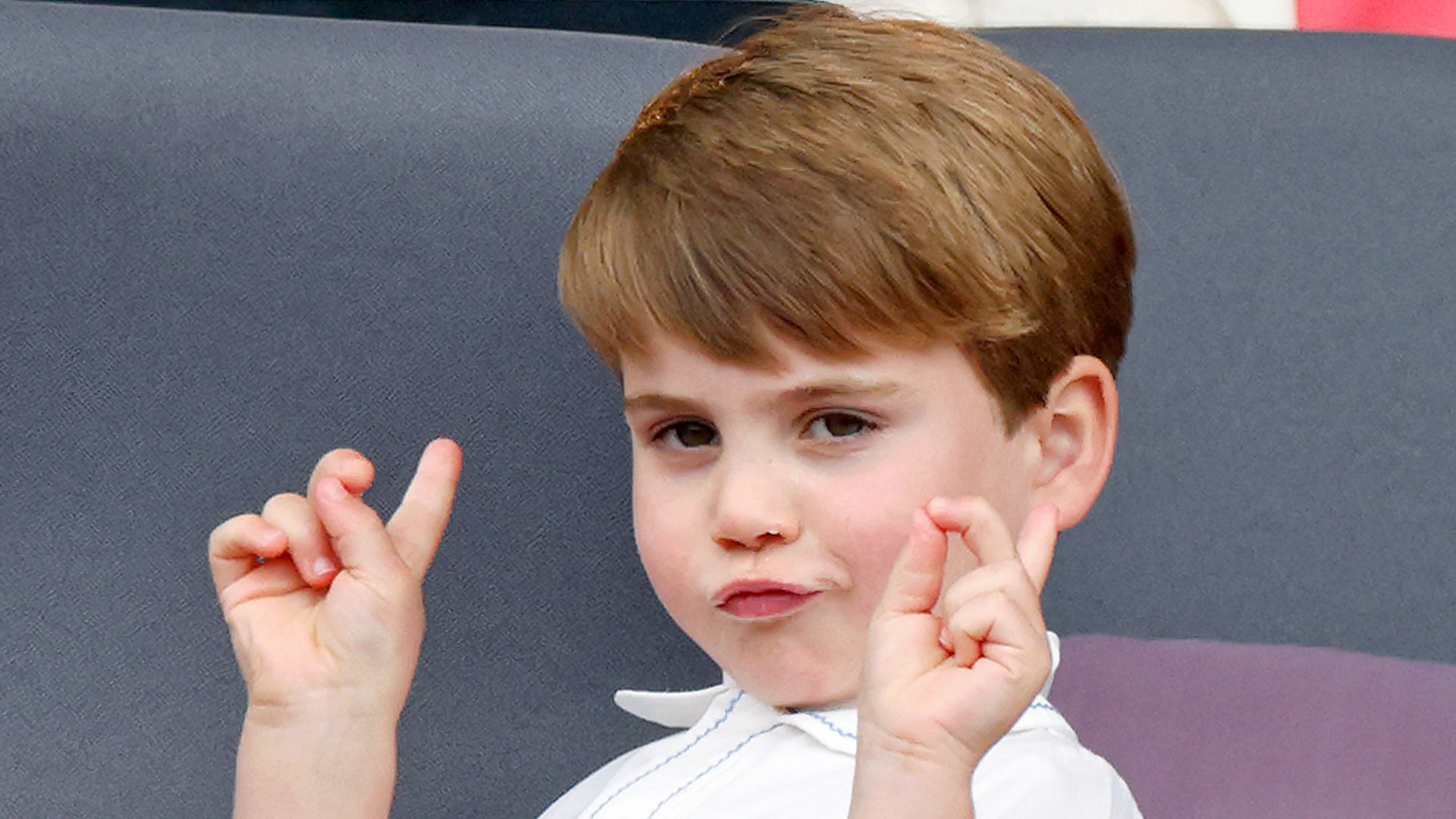 Prince Louis pulling playful face