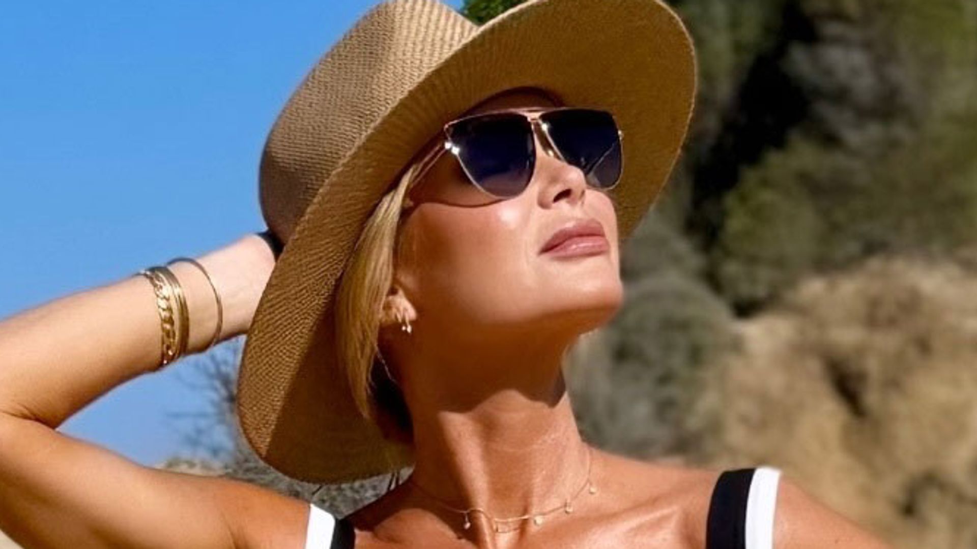 Amanda Holden black swimsuit