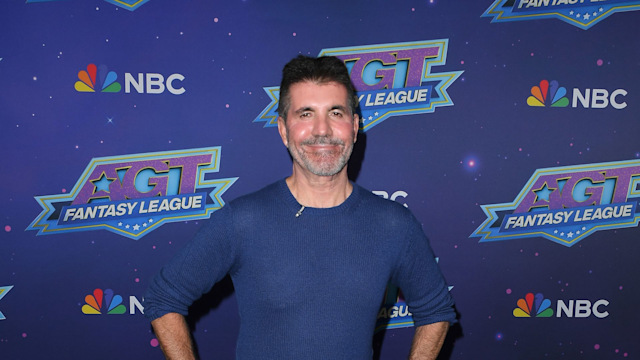 Simon Cowell in a long-sleeved blue top and blue denim jeans