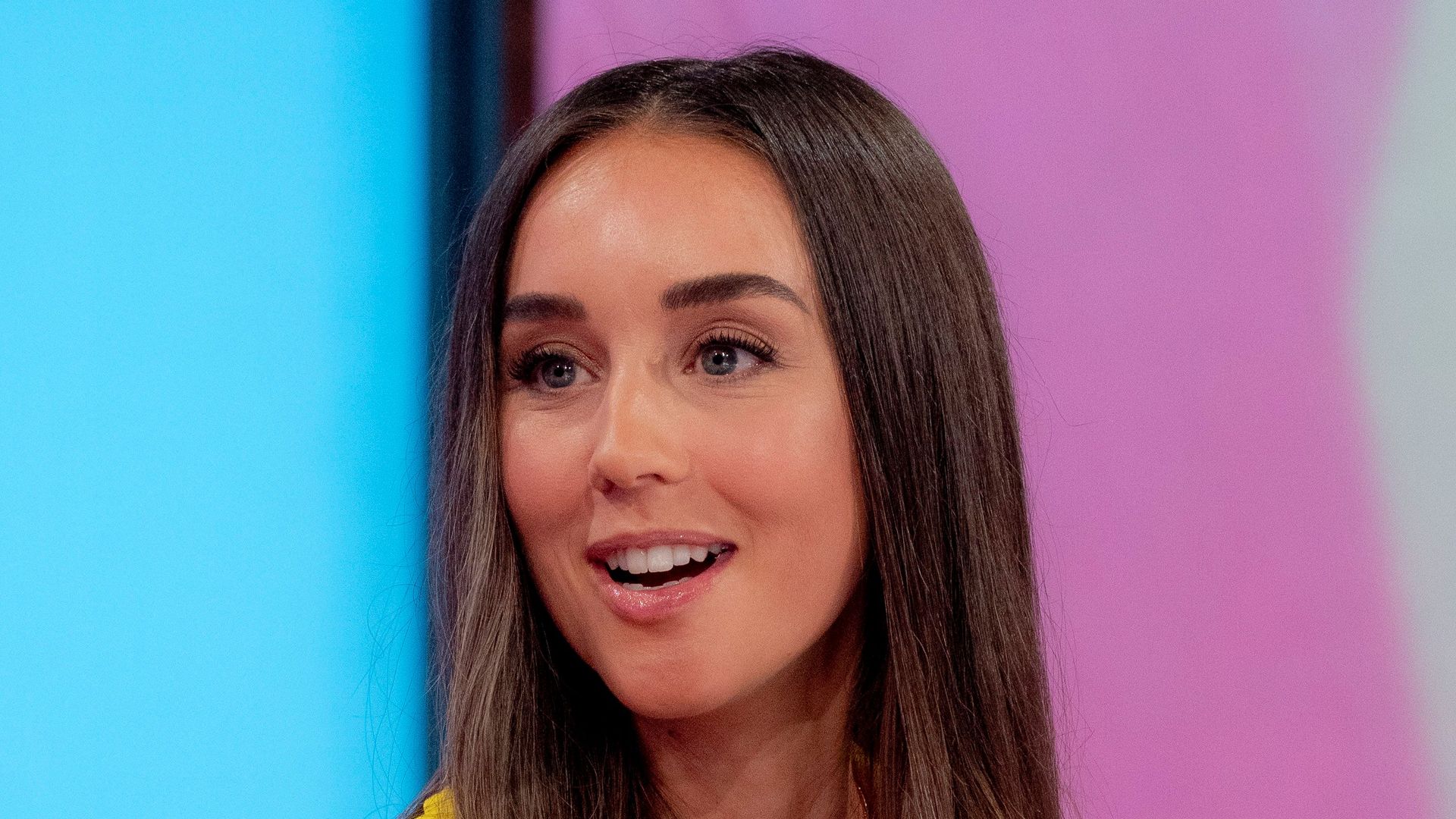 woman on chat show in yellow dress