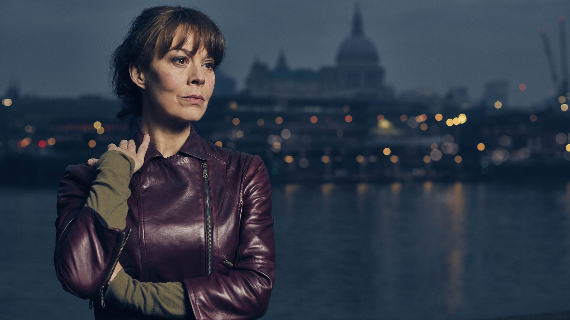 Helen McCrory posing as Emma in Fearless, with a view of London behind her. 
