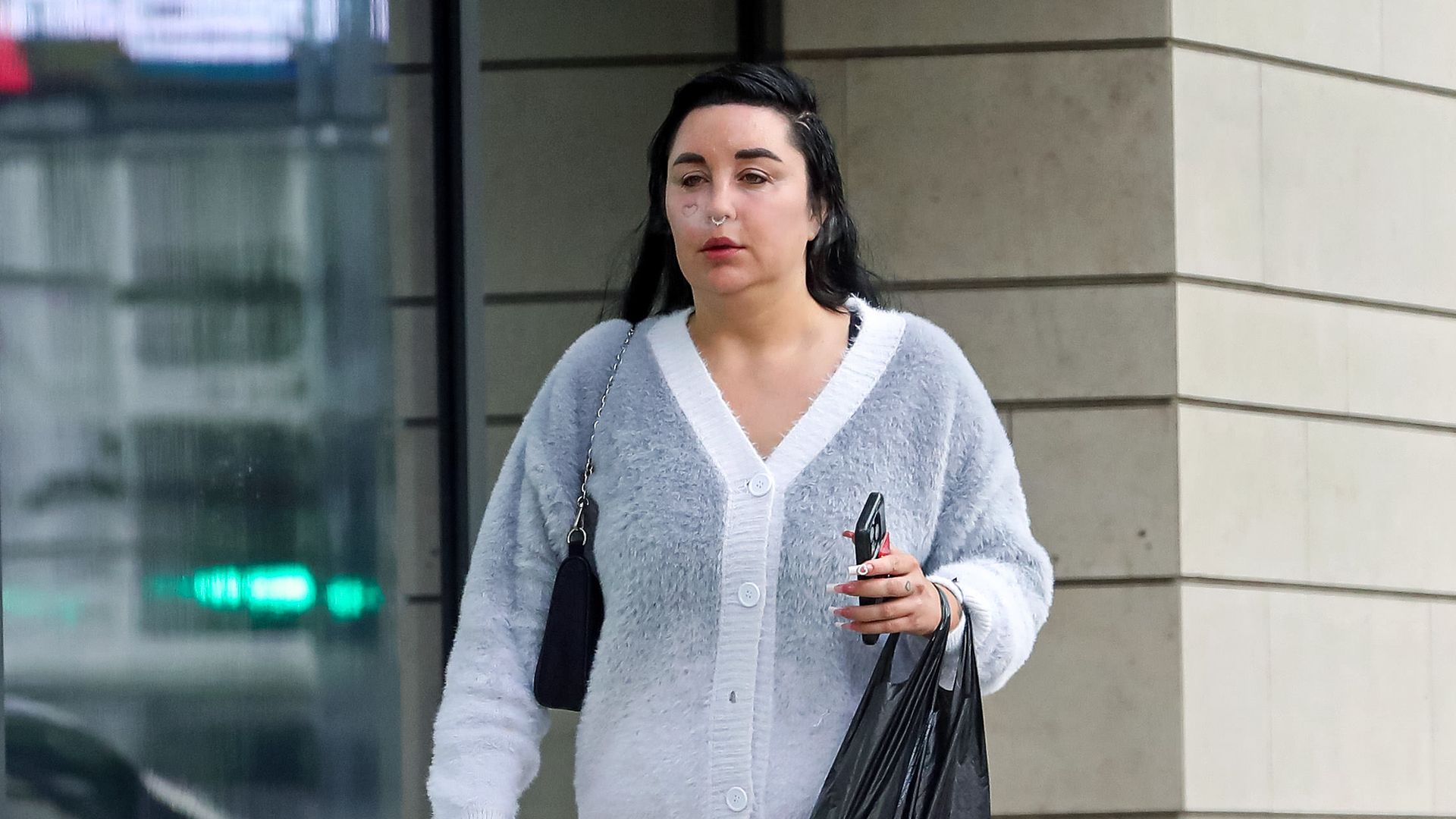 Amanda Bynes walking in LA in a cardigan and mini skirt