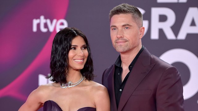 Eric Winter and Roselyn Sanchez pose for photos