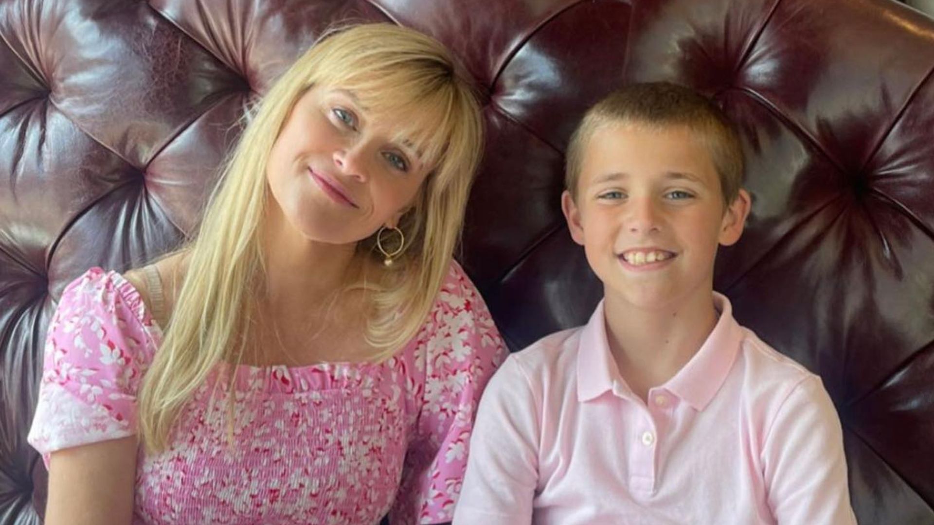 reese witherspoon and son tennessee sitting at a table