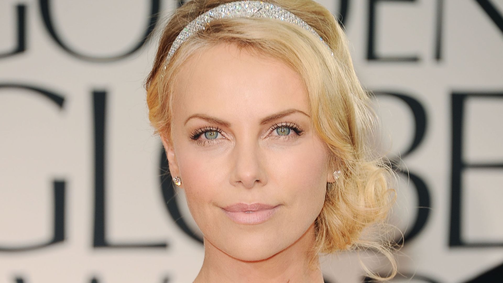 Charlize Theron arrives at the 69th Annual Golden Globe Awards in 2012