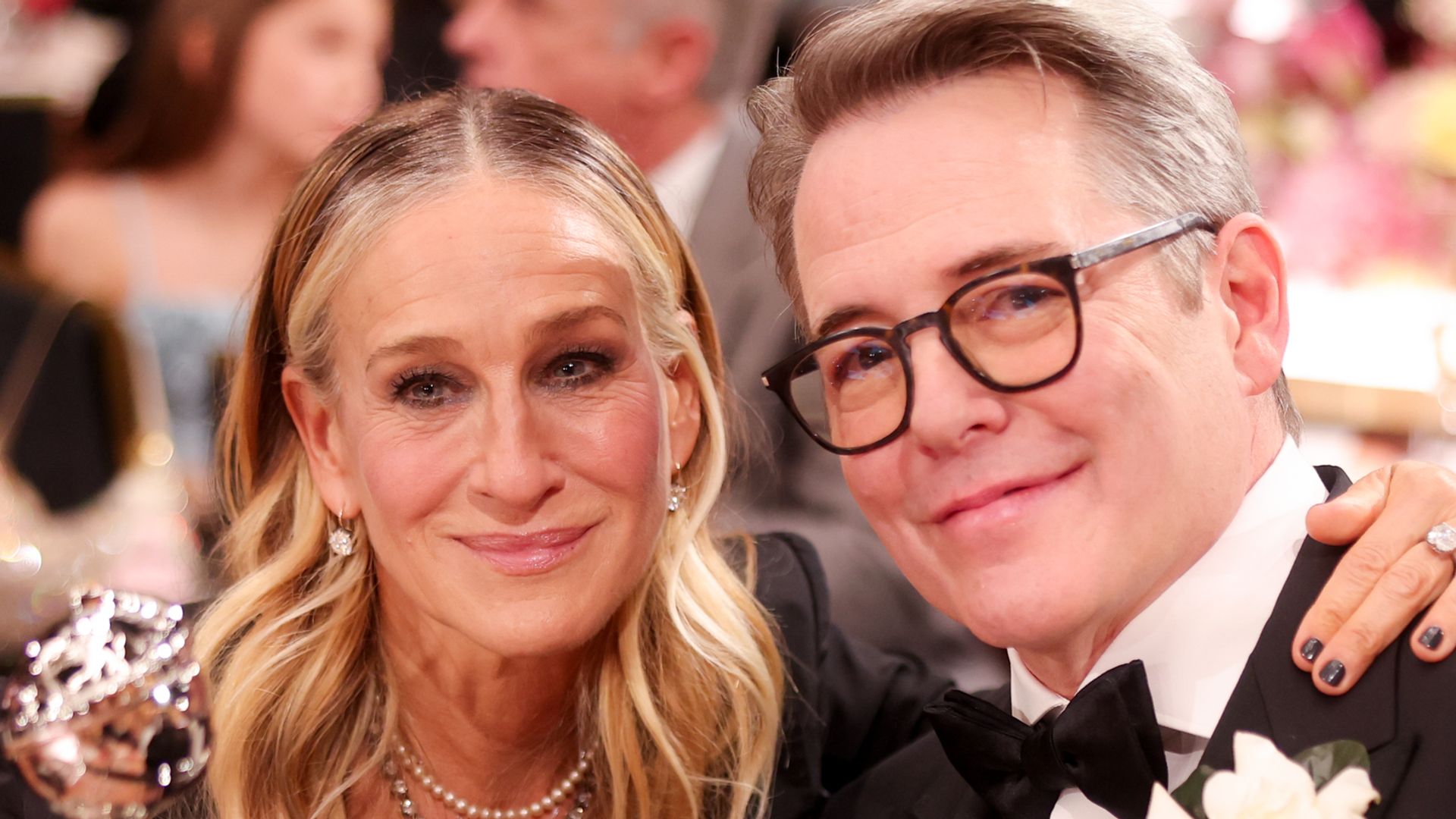 sarah Jessica Parker and Matthew Broderick sat at table together smiling