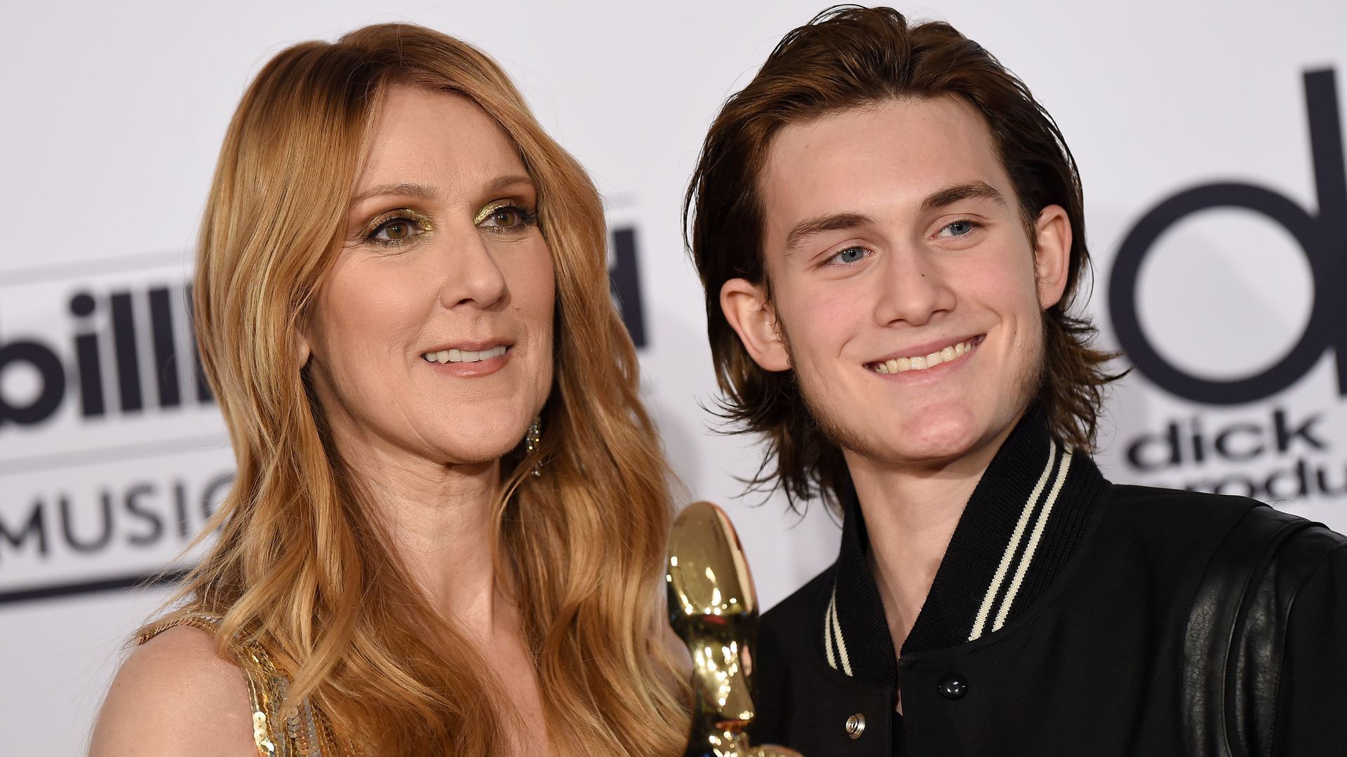 Celine Dion standing with her son