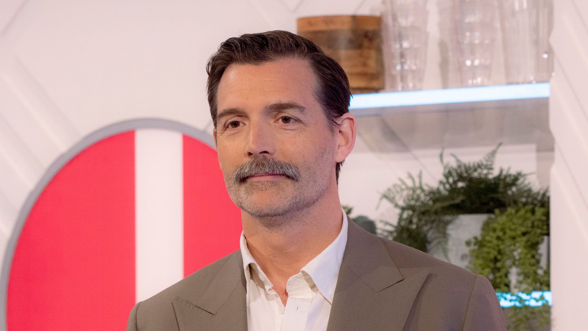 Patrick Grant standing with a mug on Lorraine