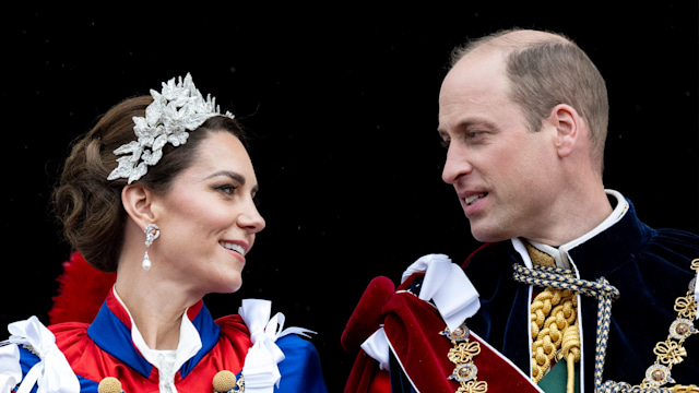 William and Kate looking at each other on palace balcony at the coronation