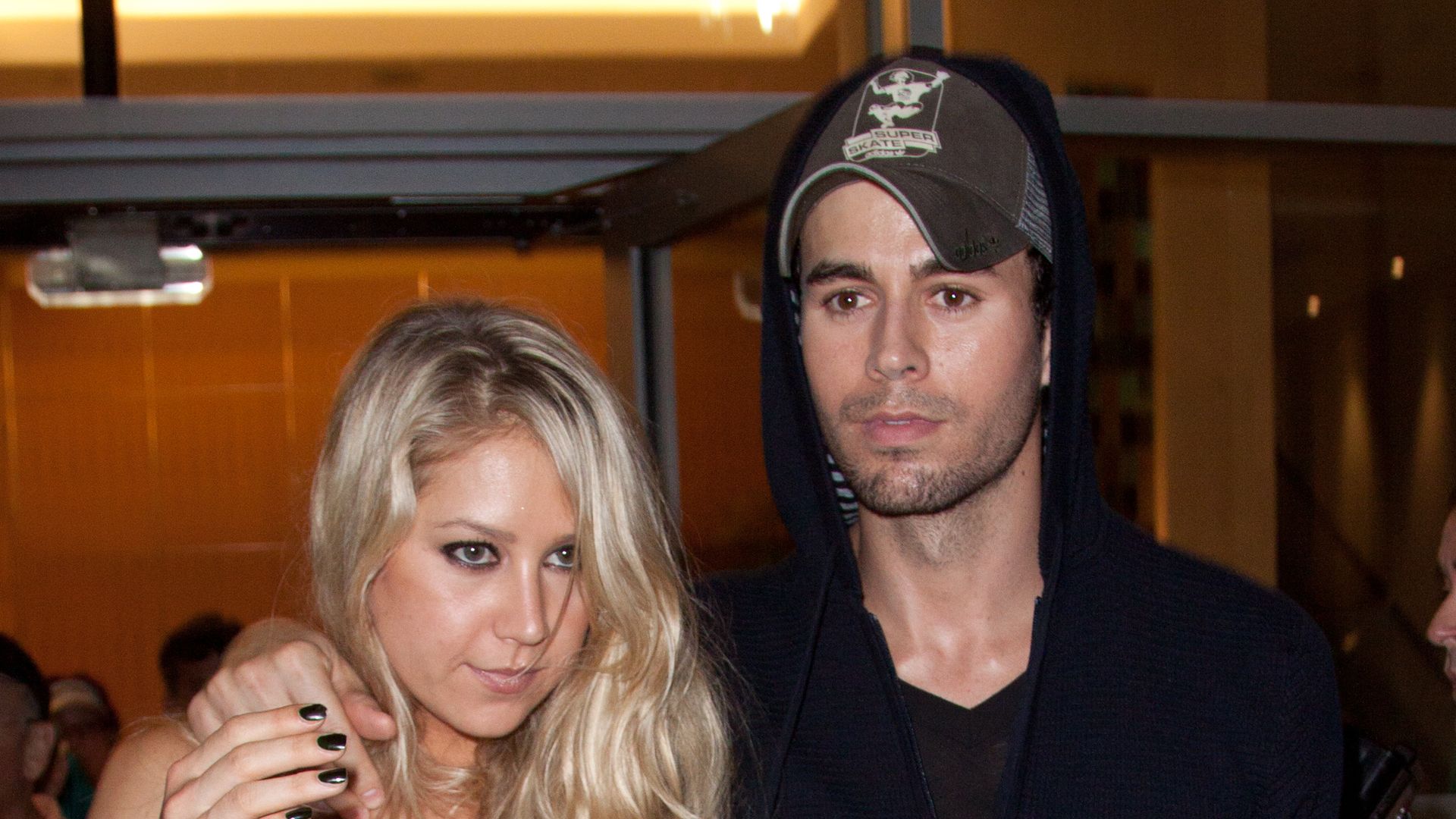 Anna Kournikova pictured in a wheelchair alongside her kids with Enrique Iglesias