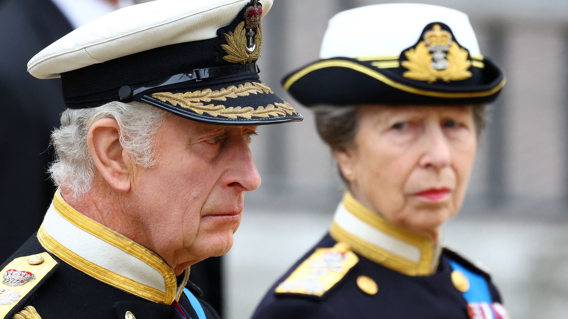 Princess Anne and King Charles in military attire at The State Funeral Of Queen Elizabeth II