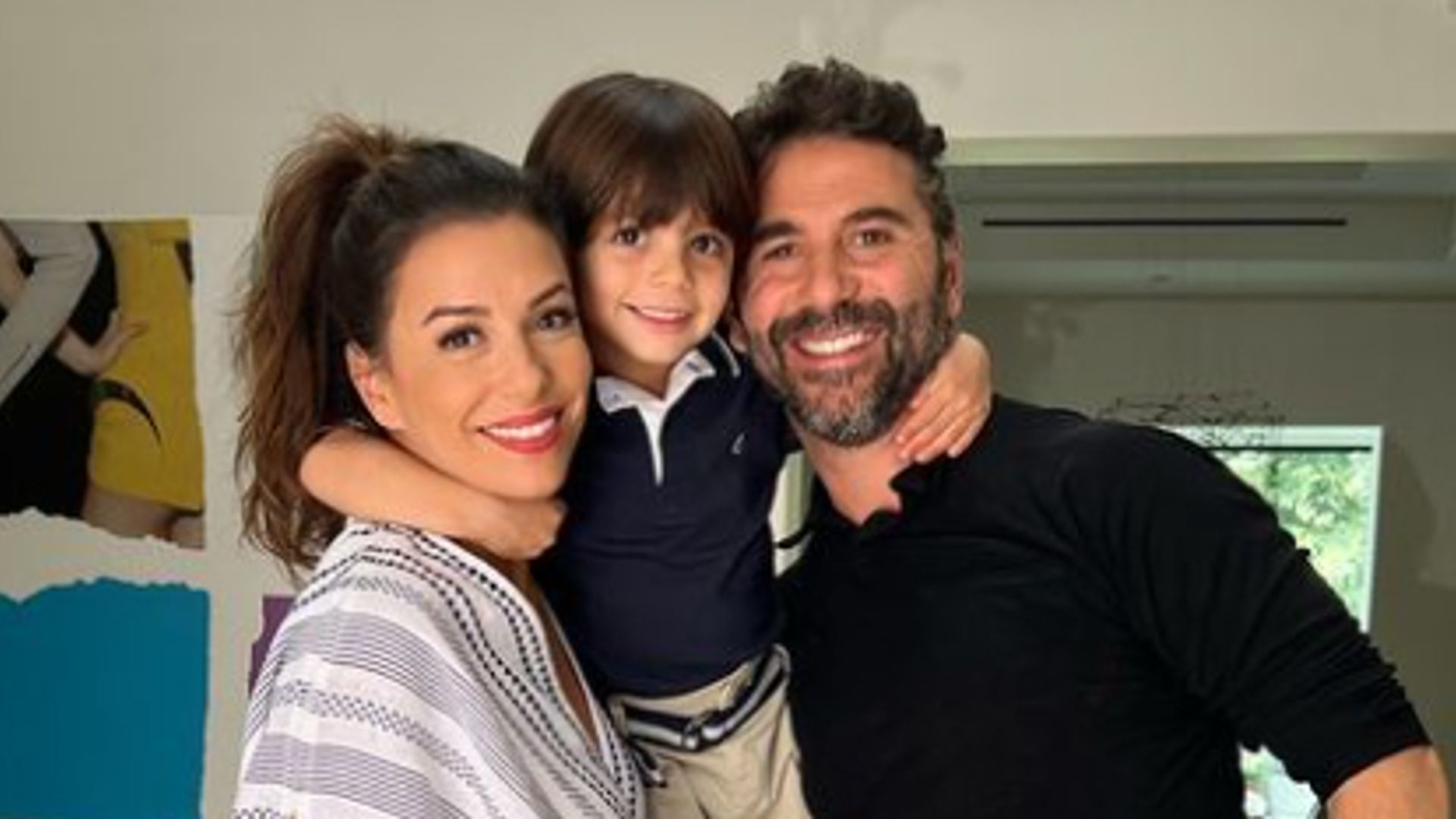 Eva Longoria and her husband with their son balancing between their heads