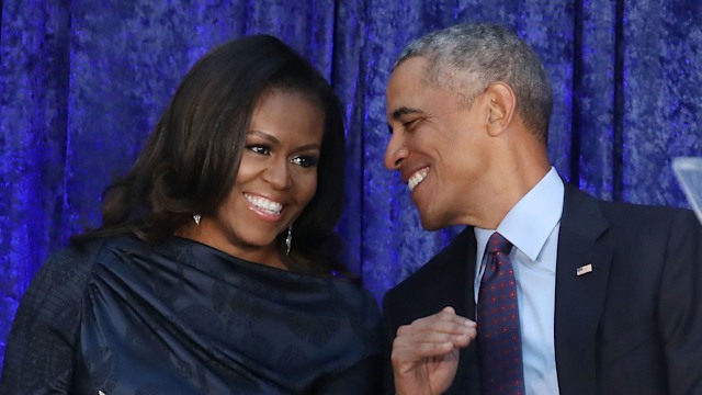 President Barack Obama and first lady Michelle Obama participate in the unveiling of their official portraits during a ceremony at the Smithsonian's National Portrait Gallery, on February 12, 2018 in Washington, DC. The portraits were commissioned by the Gallery, for Kehinde Wiley to create President Obama's portrait, and Amy Sherald that of Michelle Obama.  (Photo by Mark Wilson/Getty Images)