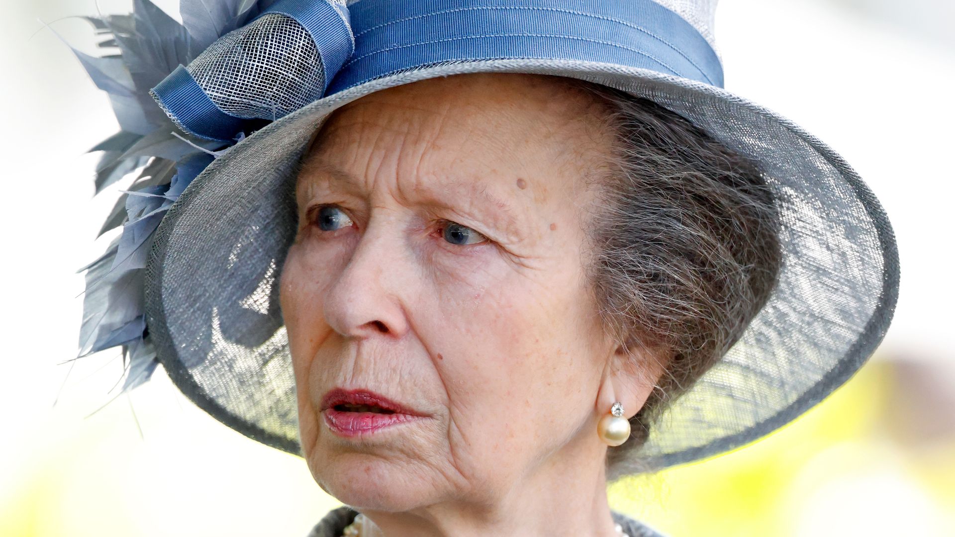woman in blue hat and occasionwear